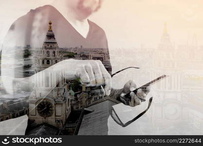 Double exposure of Designer hand with eyeglass using smart phone for mobile payments online shopping,omni channel,on white background,London architecture buildings