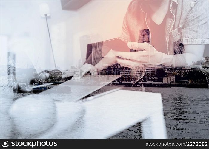 double exposure of designer man hand using laptop compter and mobile payments online shopping,omni channel,sitting on sofa in living room,green apples in wooden tray,London city buildings