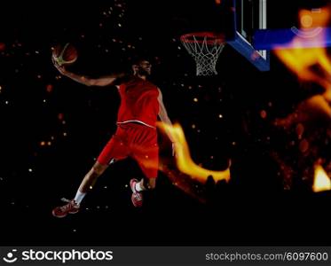 double exposure of fire and basketball player, sport player in action isolated on black background