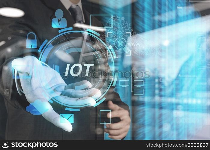double exposure of hand showing Internet of things (IoT) word diagram as concept