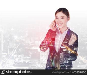double exposure of happy business woman talking on smartphone with a city background