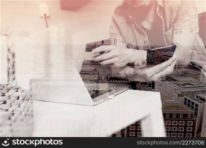double exposure of hipster hand using smart phone and laptop compter,holding cradit card payments online business,sitting on sofa in living room,green apples in wooden tray,London city buildings