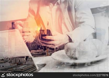 double exposure of hipster hand using smart phone,digital tablet docking keyboard,holding credit card payments online business,sitting on sofa in living room,work at home,London architecture city