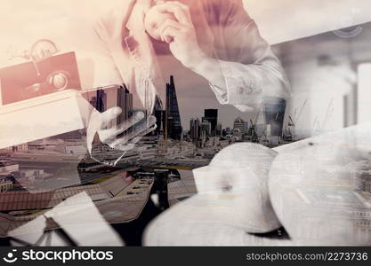 double exposure of hipster hand using smart phone for mobile payments online business,sitting on sofa in living room,holding green apple in wooden tray,London architecture city