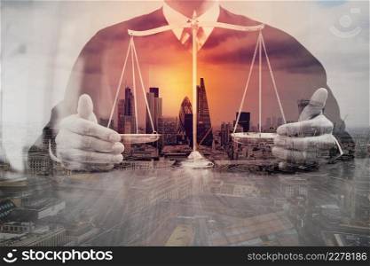 Double exposure of justice and law concept.Male judge in a courtroom with the balance scale on wood table,London city