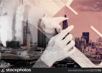 double exposure of man hand using VOIP headset with digital tablet computer docking keyboard,smart phone,concept communication, it support, call center and customer service help desk,London architecture city