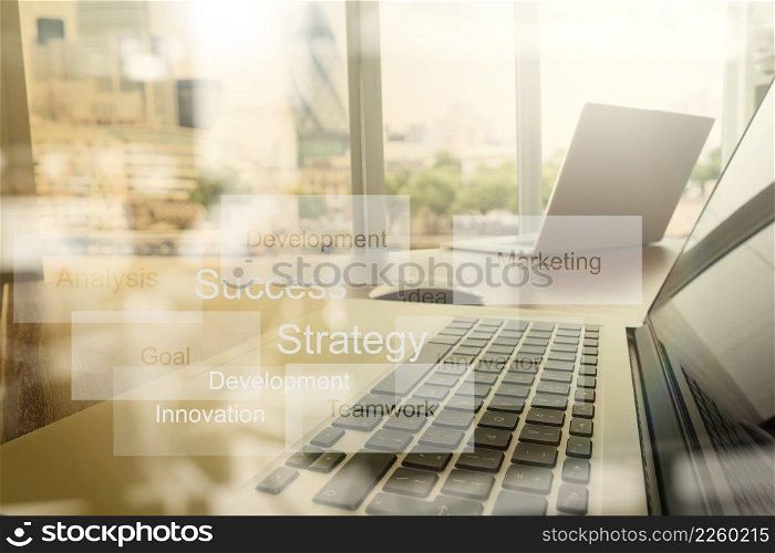 double exposure of new modern laptop computer with businessman hand working and business strategy as concept
