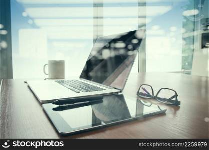 double exposure of Office workplace with laptop and smart phone on wood table with eyeglasses on digital tablet