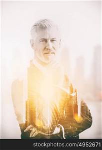 Double exposure of senior businessman in front of the big city