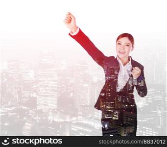double exposure of success business woman keeping arms raised with a city background