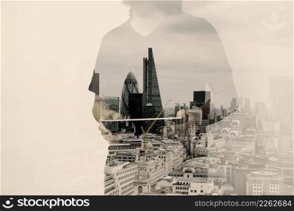 Double exposure of success businessman using digital tablet with london building and social media diagram as concept