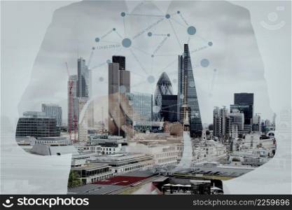 Double exposure of success businessman using smart phone and social media diagram with london city blurred background