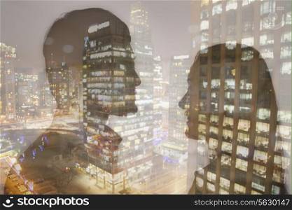 Double exposure of young couple over night cityscape