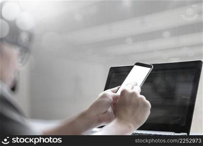 double exposure of young designer working with blank screen smart phone and computer in bed as concept