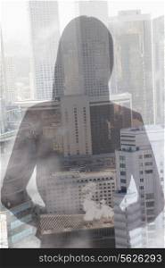 Double exposure of young woman over cityscape