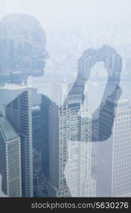 Double exposure of young woman taking picture over cityscape