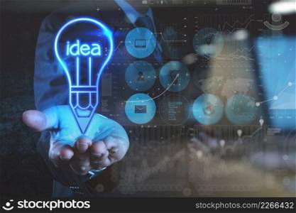 double exposure photo of businessman hand draws lightbulb with new computer interface as solution business concept