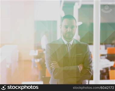 Double exposure with low poly design. Happy young business man portrait at modern meeting office indoors