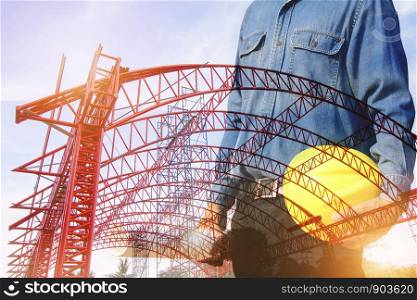 Double image of an engineer with a helmet with a steel roof structure background