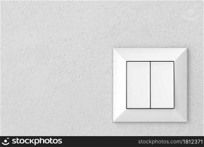Double light switch on a gray wall, front view