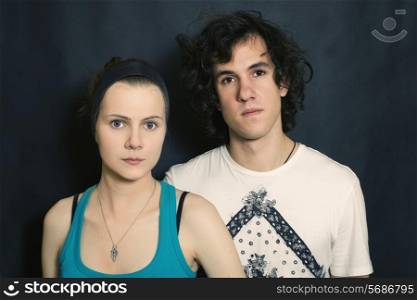 double portrait of young men and women on a black background
