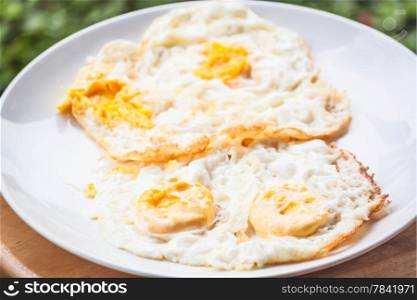Double serving of star eggs on white plate