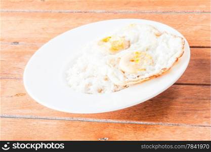 Double star eggs topped on dish of rice