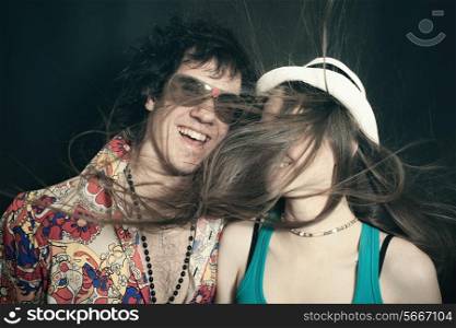 Double studio portrait of young lovers, men and women on a black background
