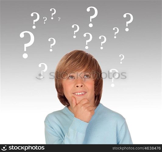 Doubtful preteen boy with many question symbols isolated on a over white background