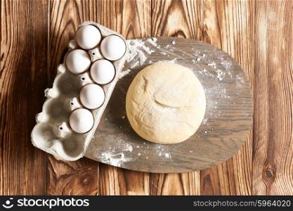 Dough on wooden table