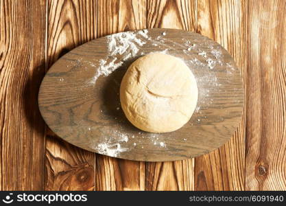 Dough on wooden table