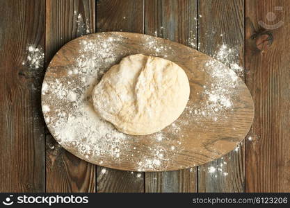 Dough on wooden table