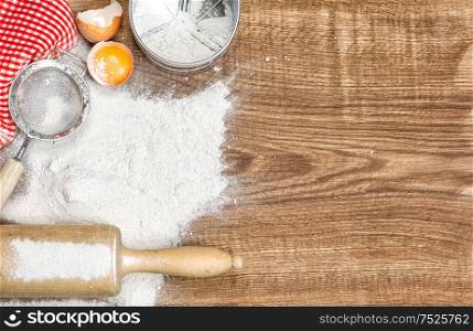 Dough preparation. Food background. Baking tools and ingredients on wooden table