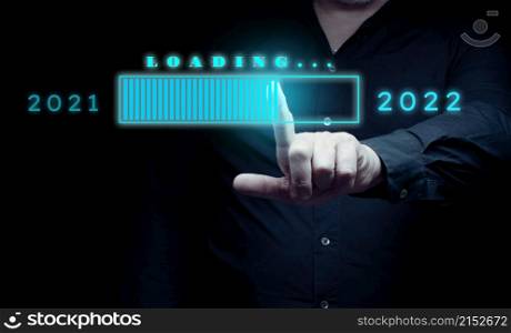 Download concept of new year 2022, man touches virtual hologram with download. The beginning of a new life, start up. Starting in business