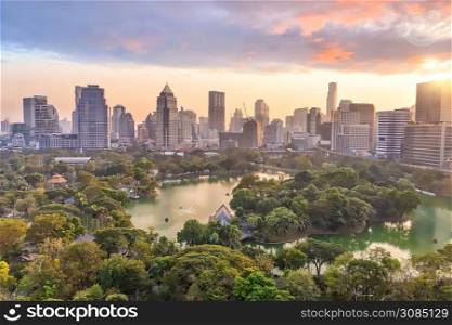 Downtown Bangkok city skyline with Lumpini park from top view in Thailand at sunset