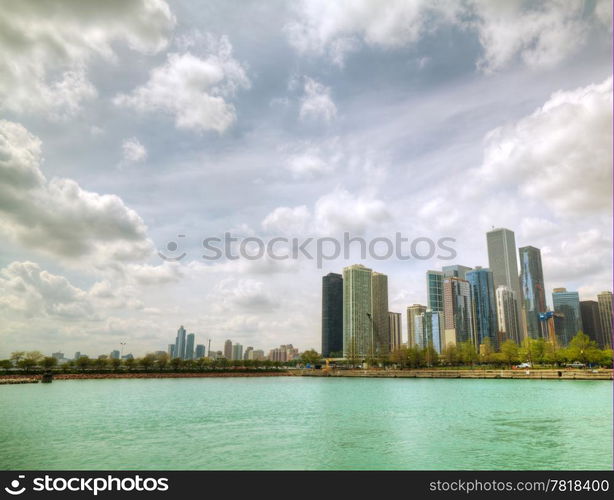 Downtown Chicago, IL as seen from the Michigan lake shore in the sunny day