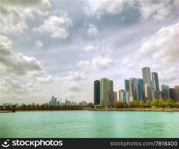 Downtown Chicago, IL as seen from the Michigan lake shore in the sunny day