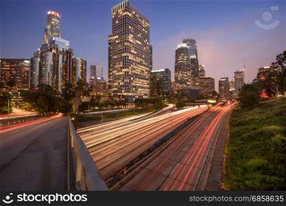 Downtown Los Angeles at night with car traffic light trails