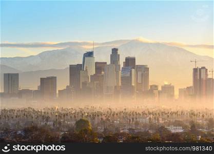 Downtown Los Angeles skyscrapers at smoggy sunrise