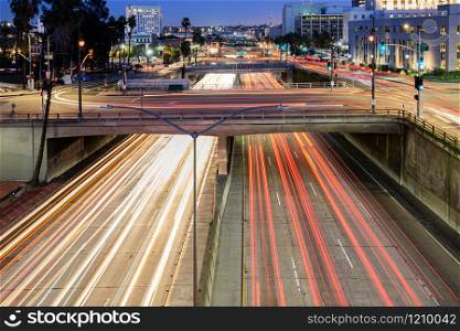 Downtown Los Angeles traffic at night. Long exposure car light trails