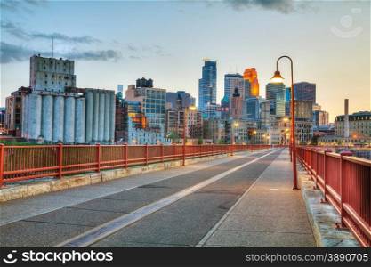 Downtown Minneapolis, Minnesota at night time as seen from the famous stone arch bridge