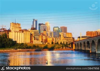 Downtown Minneapolis, Minnesota in the morning with famous Stone Arch bridge