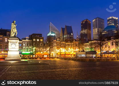 Downtown of The Hague Netherlands, with its monumental old buildings, and modern skyline in the background at dusk