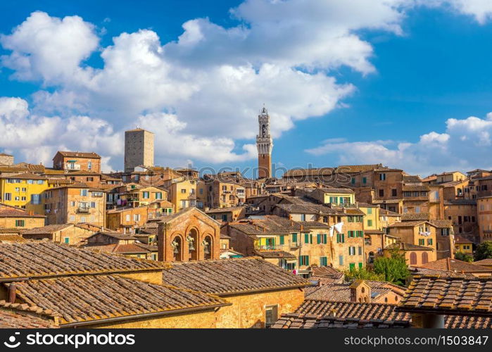 Downtown Siena skyline in Italy with blue sky