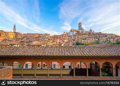 Downtown Siena skyline in Italy with morning blue sky