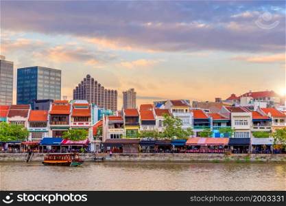 Downtown Singapore city skyline. Cityscape of Clarke Quay district area at sunset