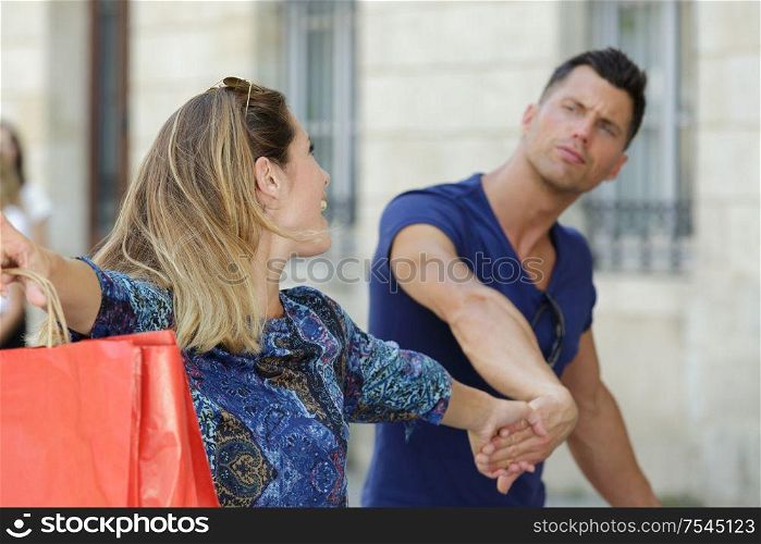 dragging her boyfriend to shop