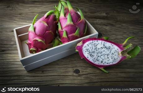 Dragon Fruit On old Wooden Table, Selective focus.
