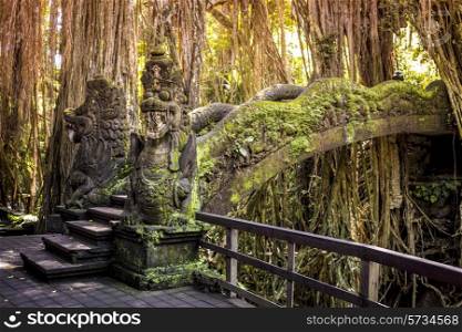 Dragon sculpture on the bridge in monkey forest, Ubud, Bali.