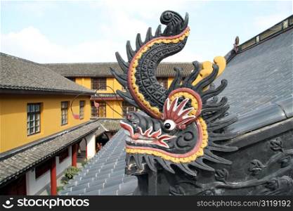 Dragon sculpture on the ropf on buddhist temple on the island Putosghan in China